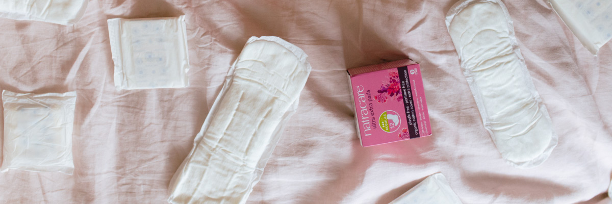 Natracare Pads on a bed