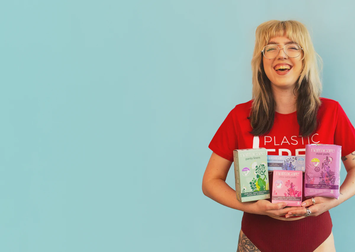 woman holding a selection of natracare products