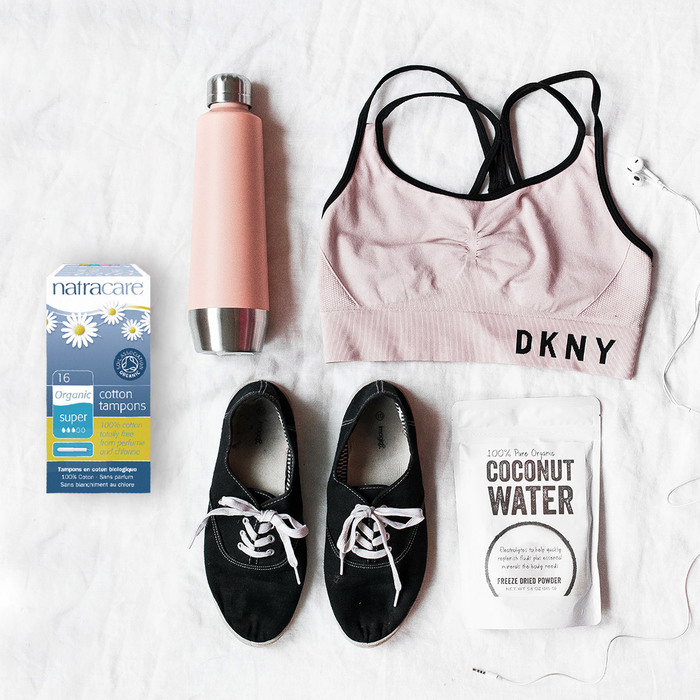 applicator tampons next to workout gear