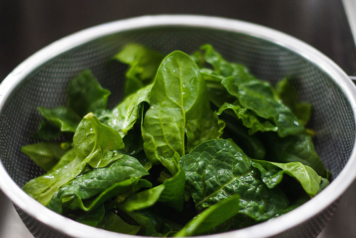 spinach in a sieve