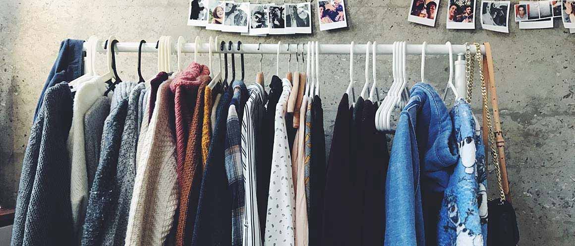 clothes hanging on rail