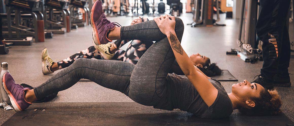 knee stretch on gym mat