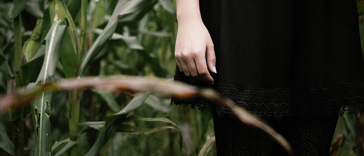 woman stood by crops