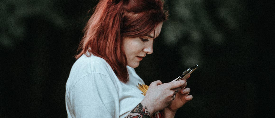 woman holding phone