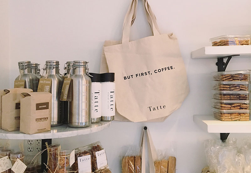 reusable water bottle and coffee cups being sold in shops