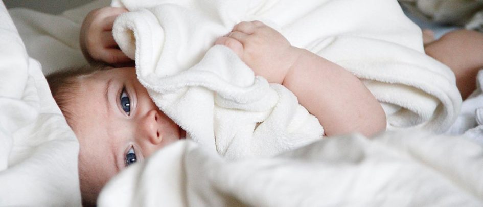 baby wrapped in towel