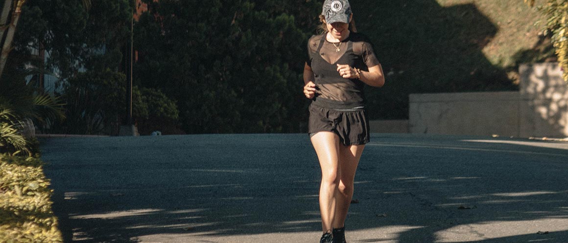 woman running outside in sun