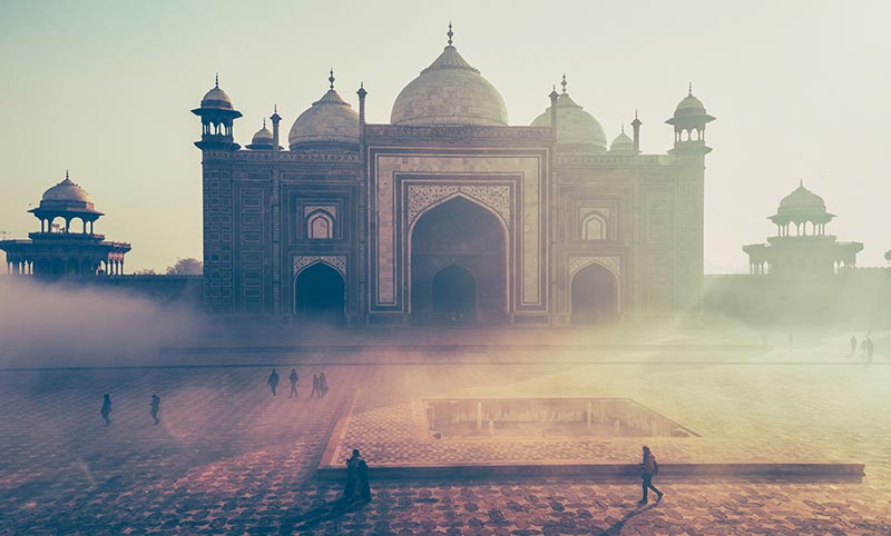 Religious building in the background behind mist