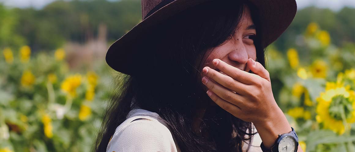 Girl laughing mischievously