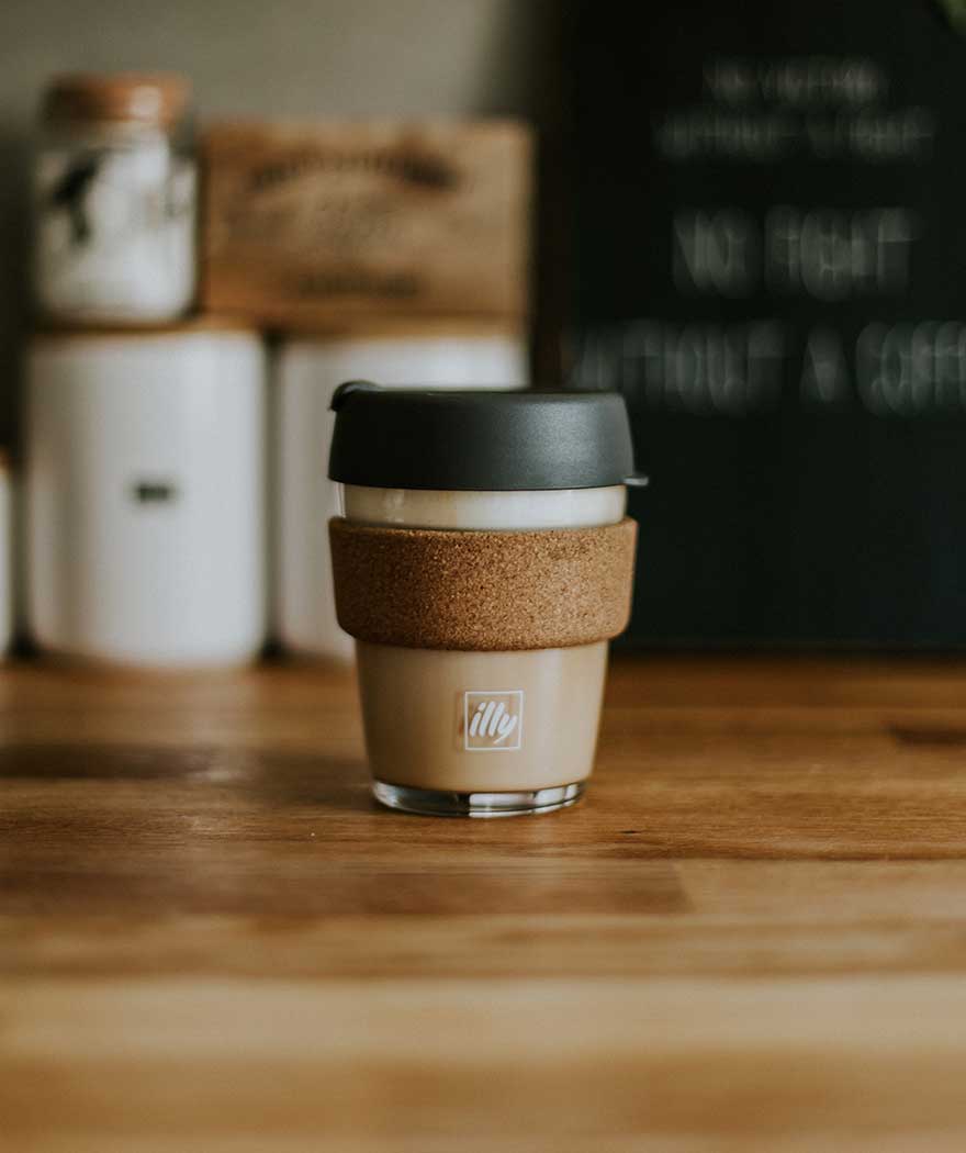 reusable coffee cup on desk