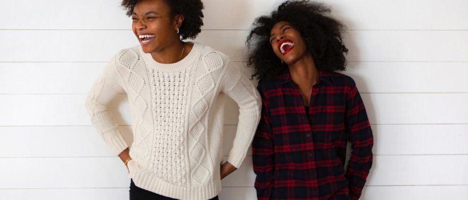 two women laughing together