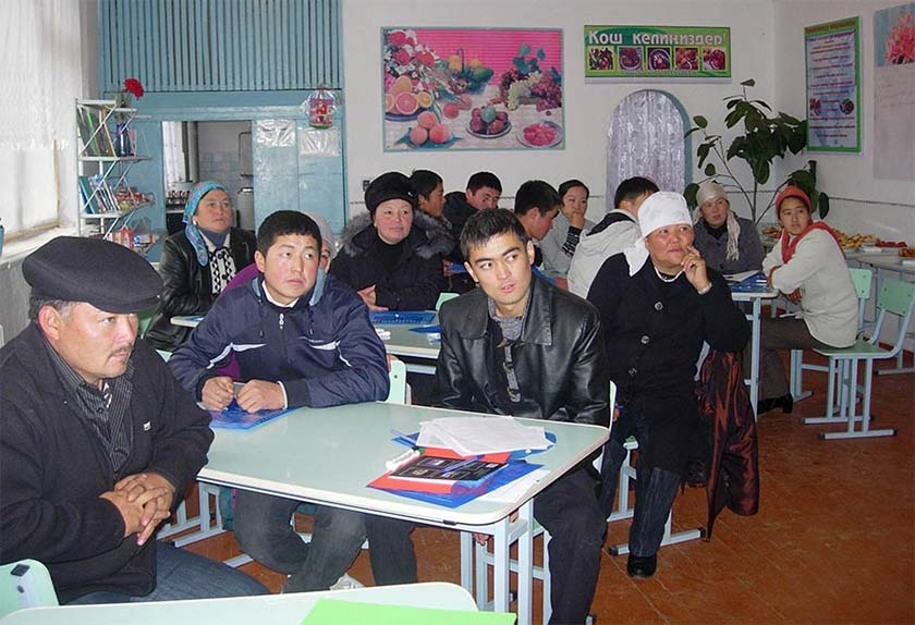 men and women learning about safe sanitation