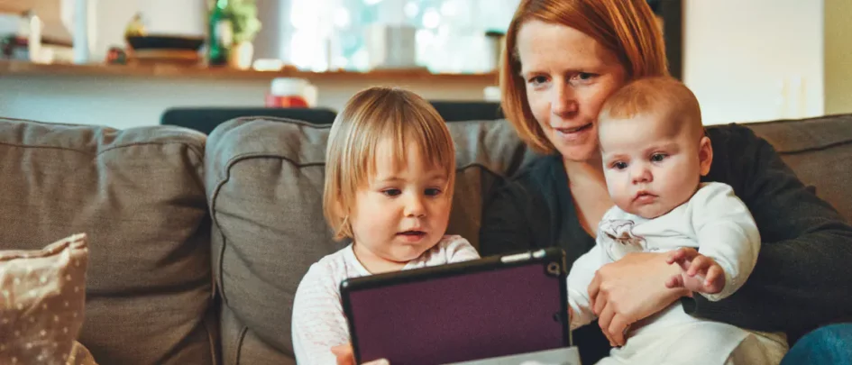 mother and children on ipad