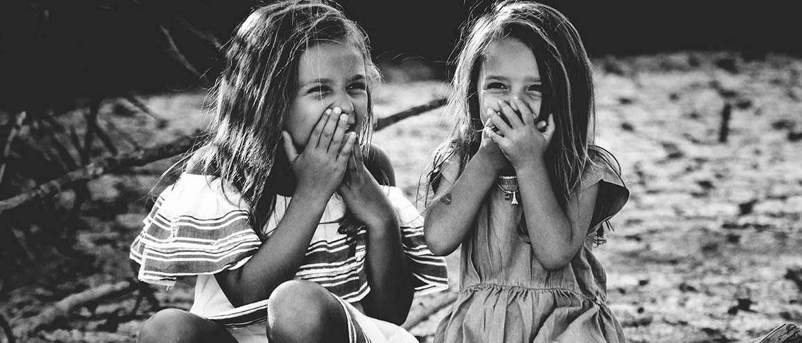 two little girls giggling