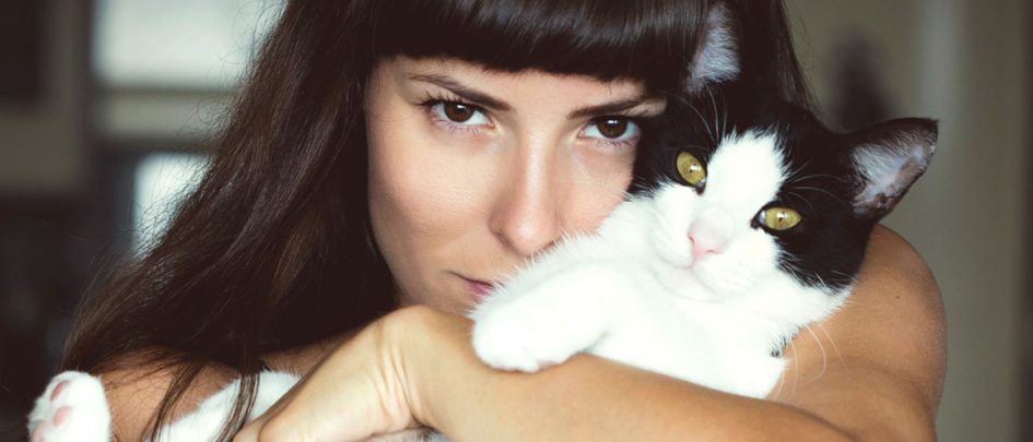 woman holding cat