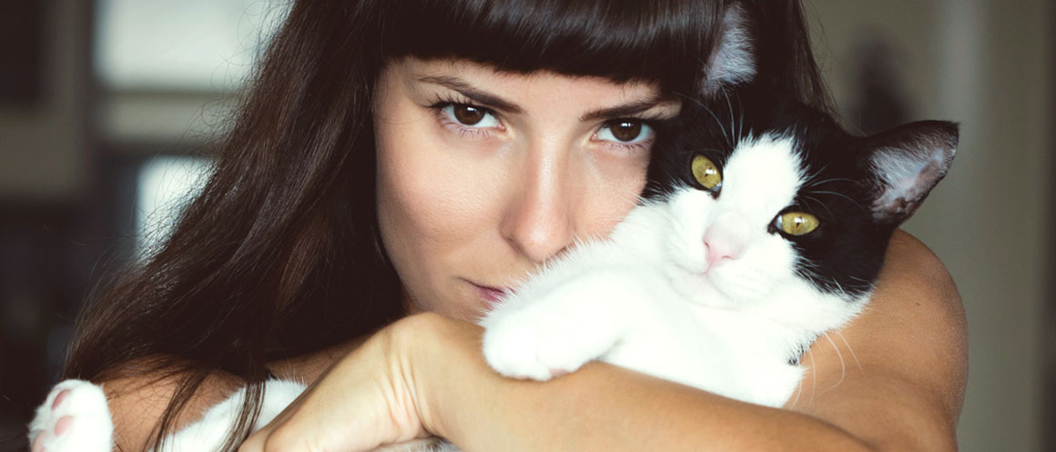 woman holding cat