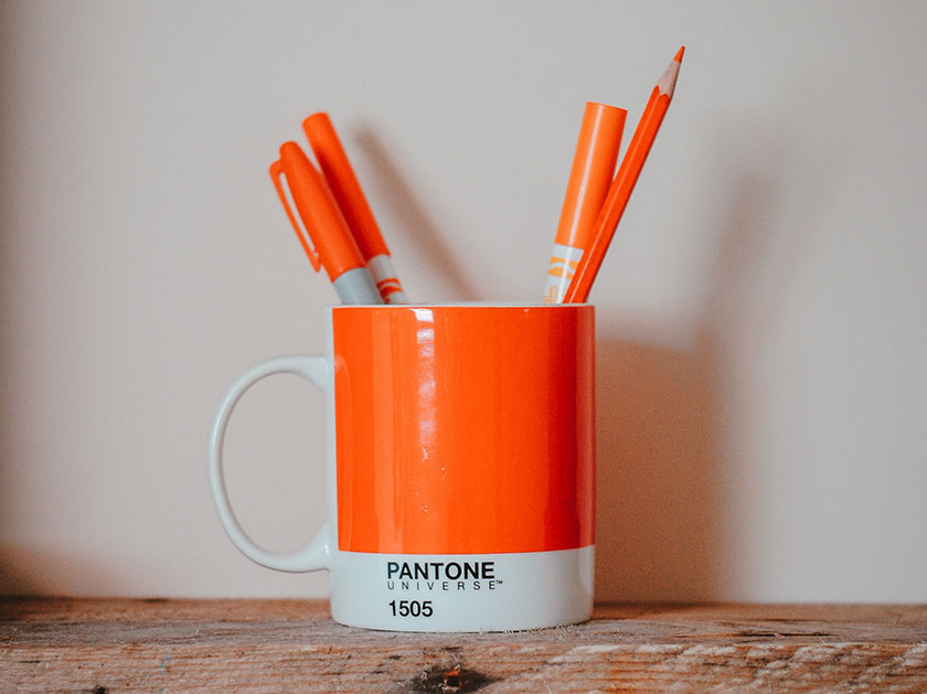 pantone orange mug and pens