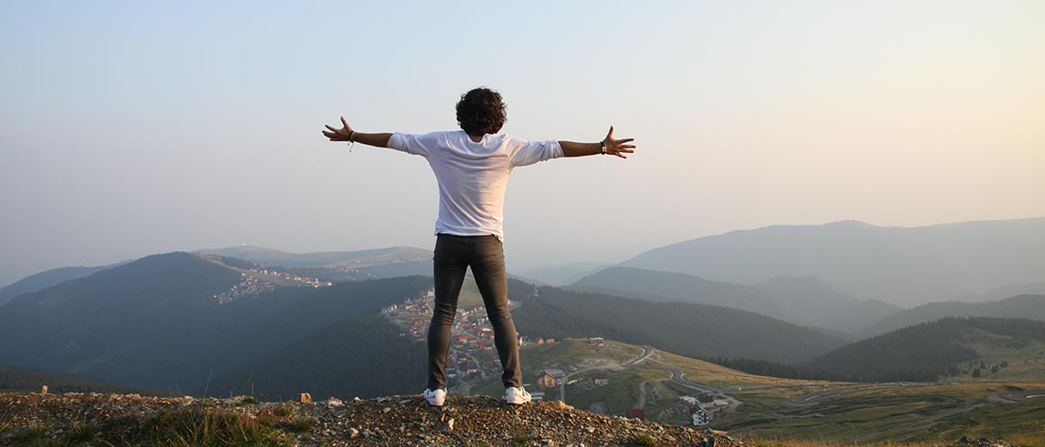 person at top of hike