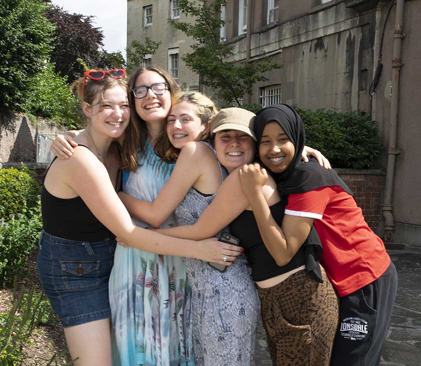A group of girls hugging
