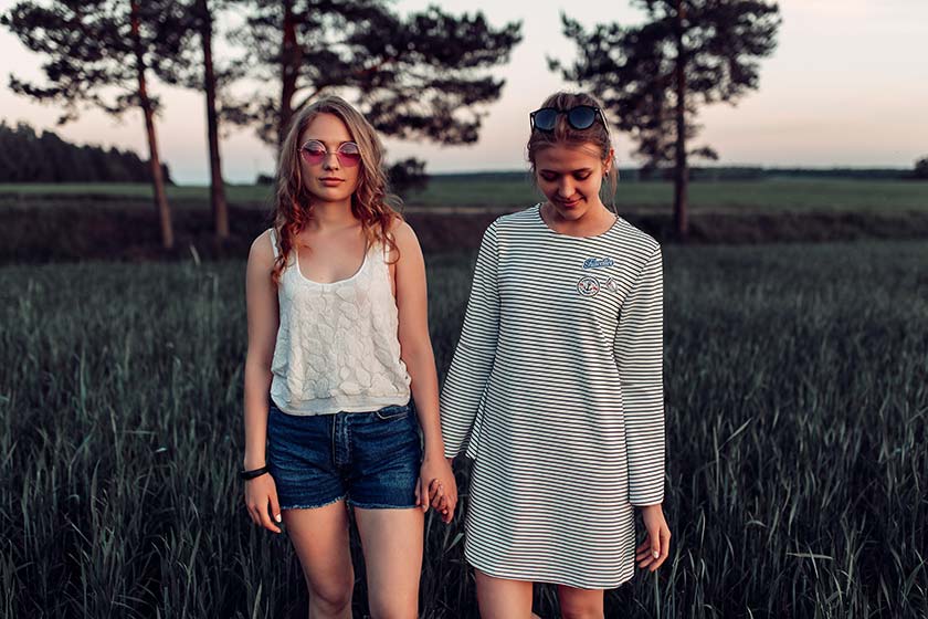 two girls holding hands