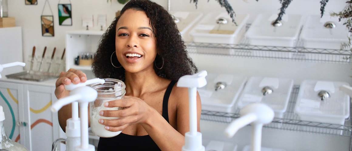 woman refilling reusable container