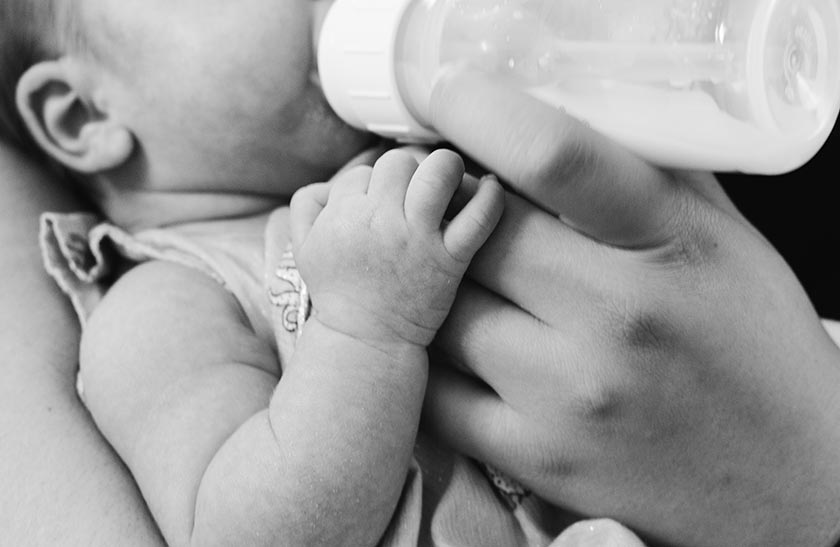 Baby being bottle fed