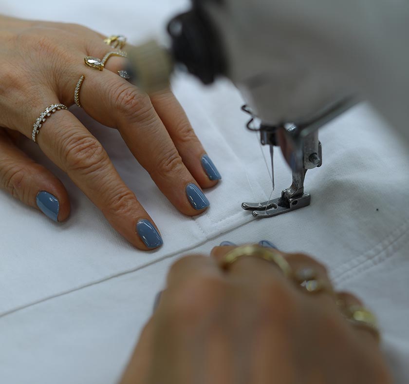 person using sewing machine