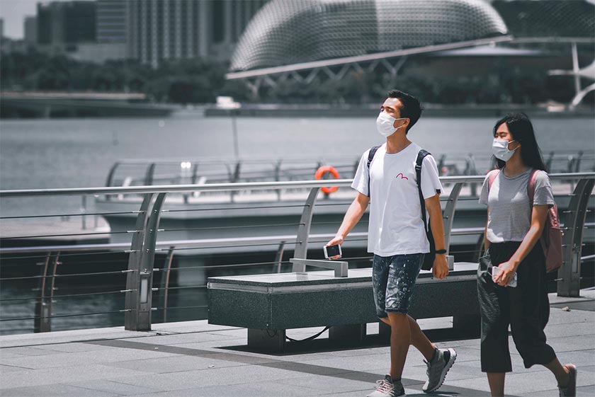 people walking around wearing masks