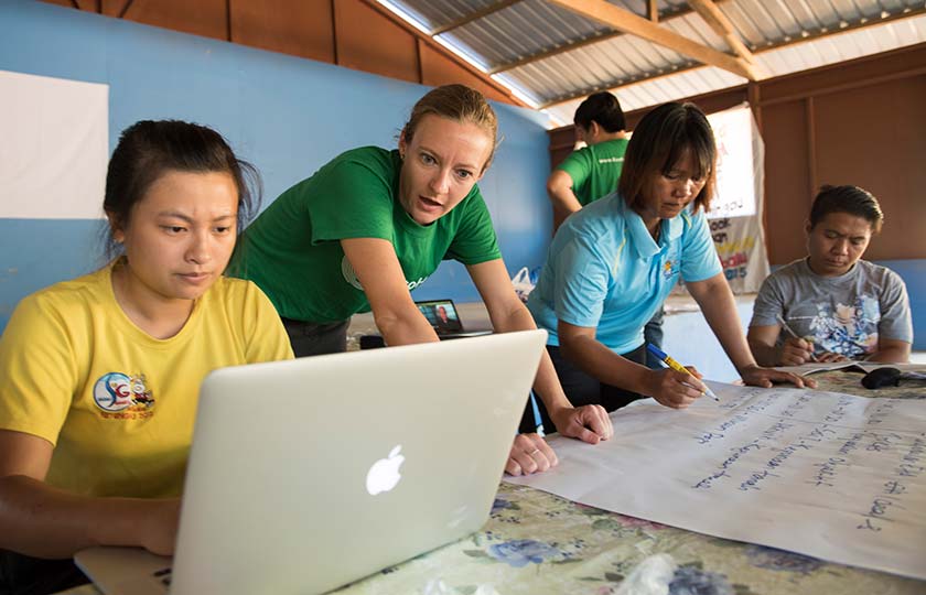 women researching on laptops