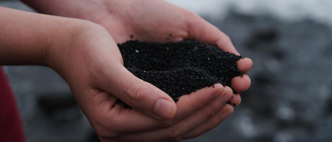 hands holding compost