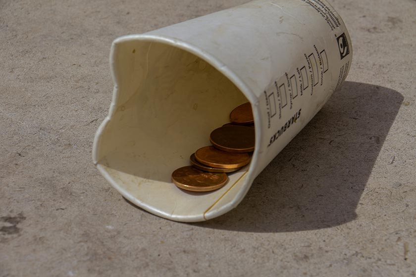 Starbucks coffee cup with change inside