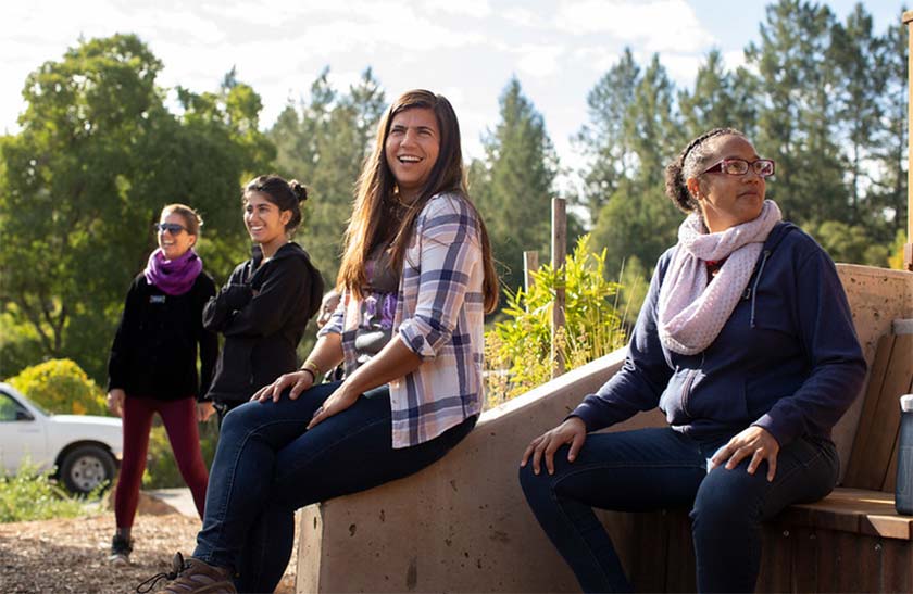 WEA program participants outdoors together, laughing and talking