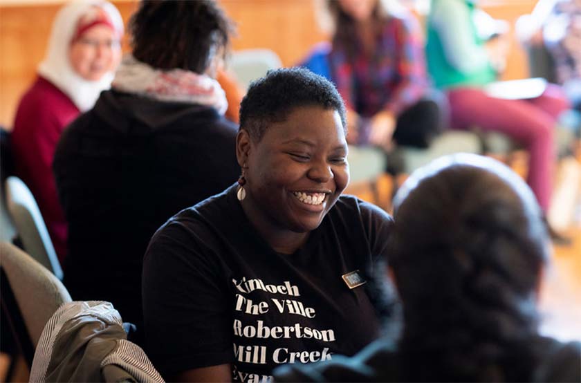 WEA program participants sat talking, laughing and smiling