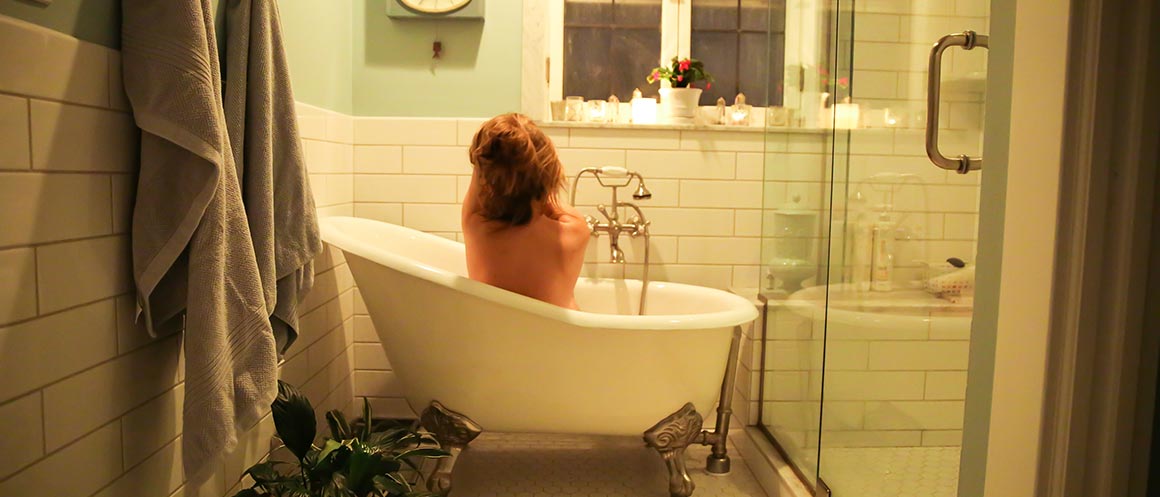 person relaxing in the bath