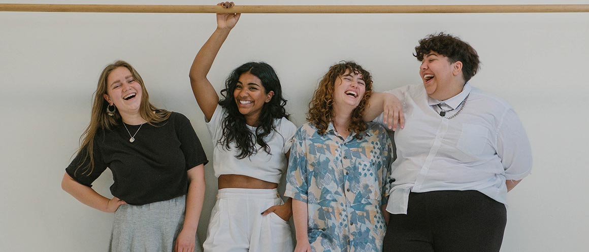 group of people smiling and laughing together