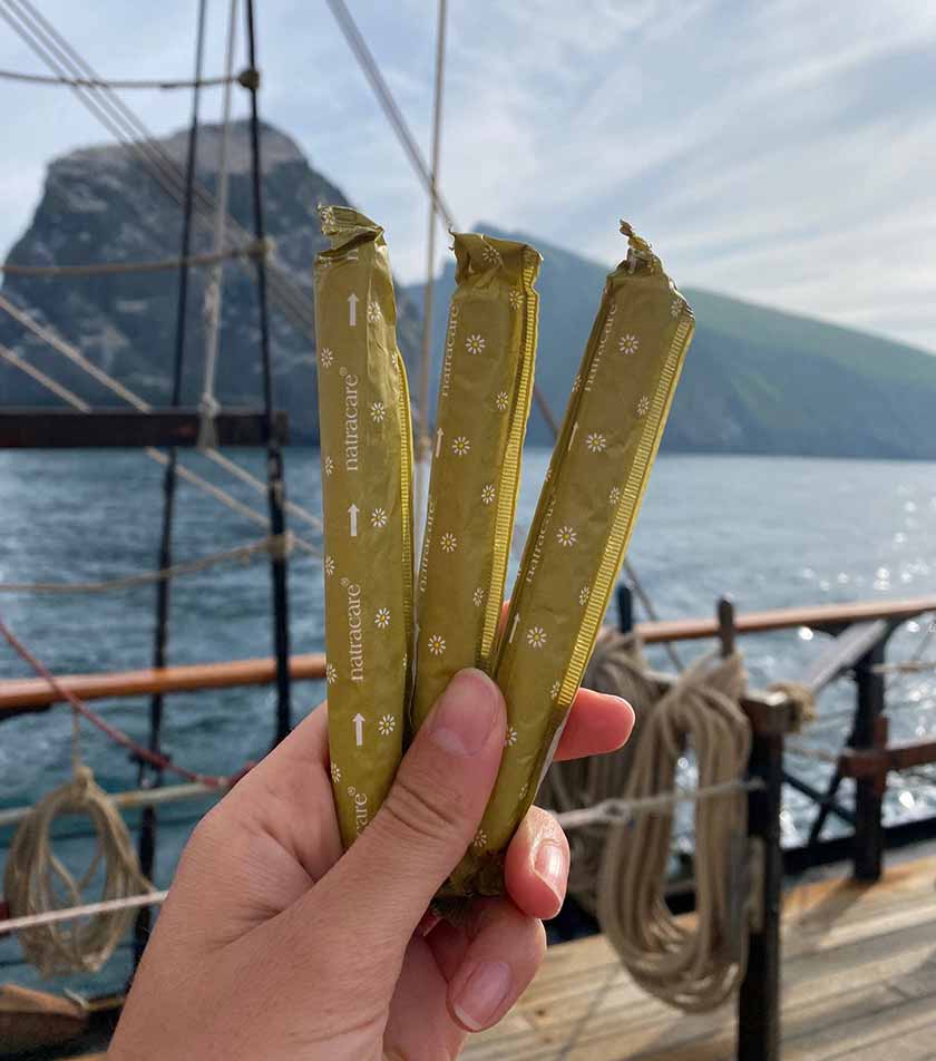 natracare tampons being held on a boat