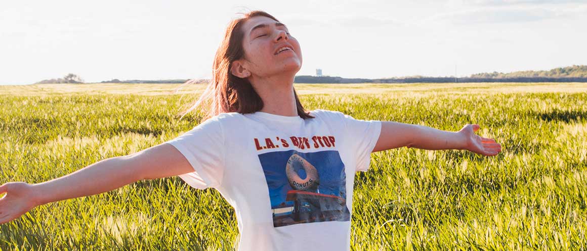 person standing happy in fields