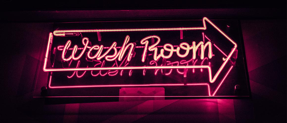 wash room neon light with arrow