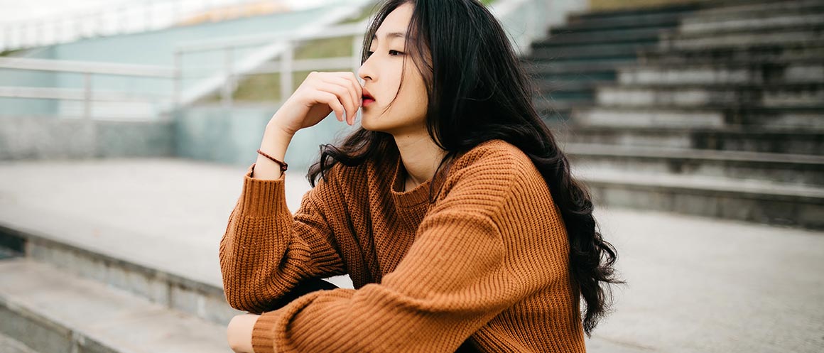 woman sat on steps