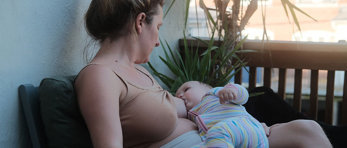 woman breastfeeding baby