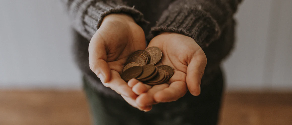 hands holding coins