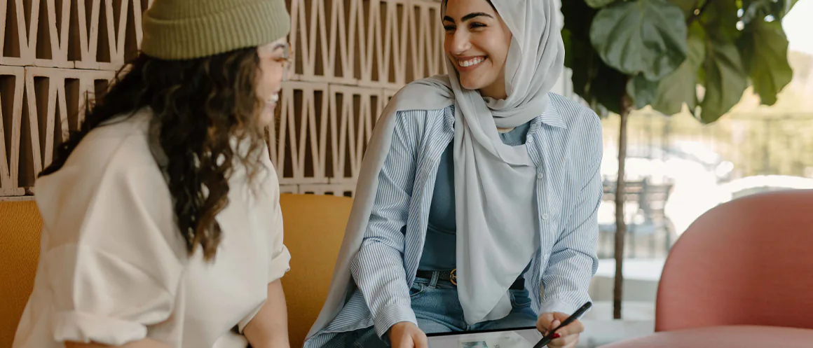 two people talking and smiling