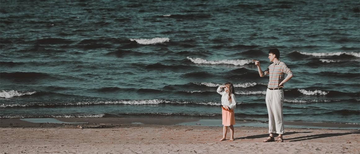 Dad and daughter on the beach